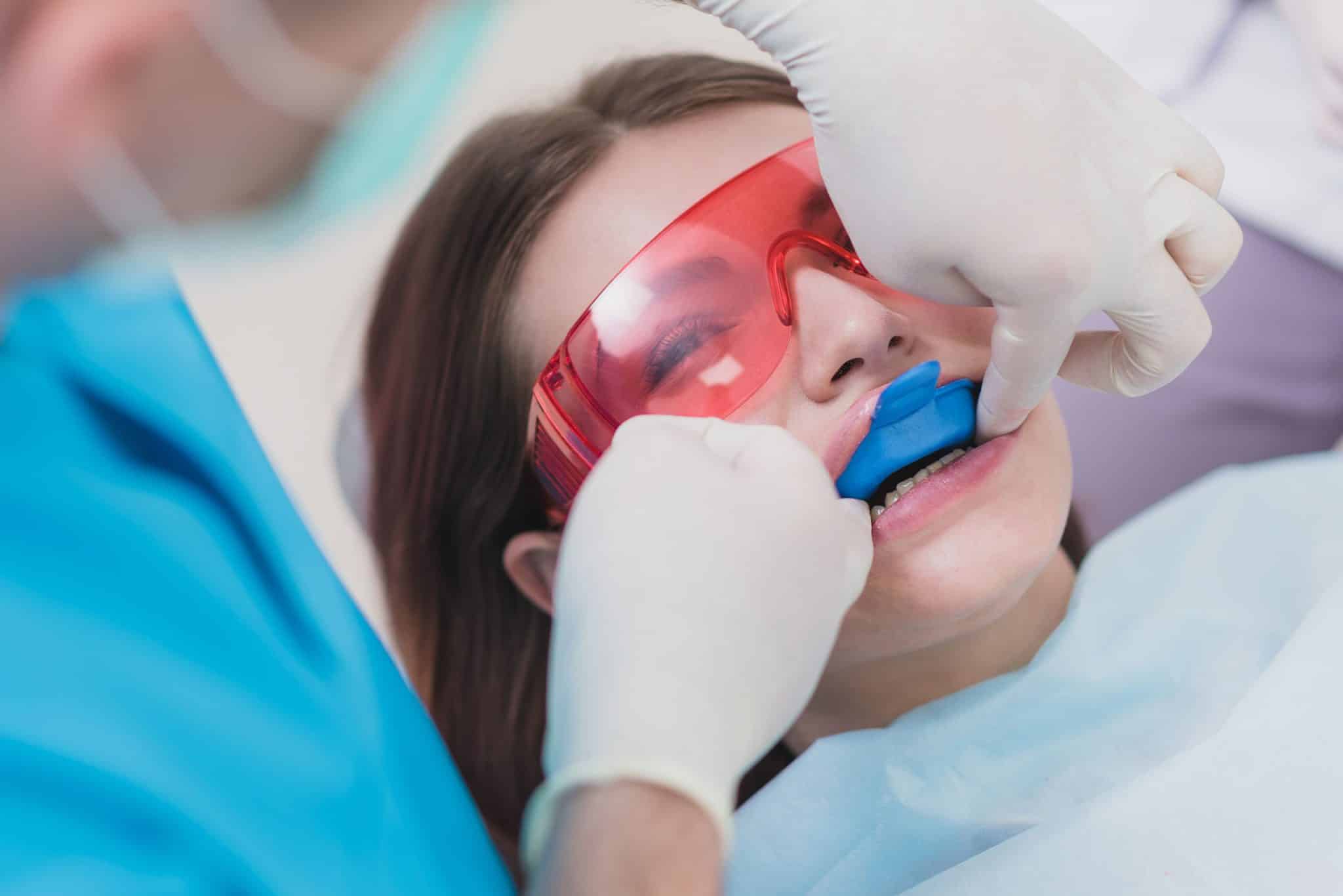 A dental patient receiving a fluoride treatment